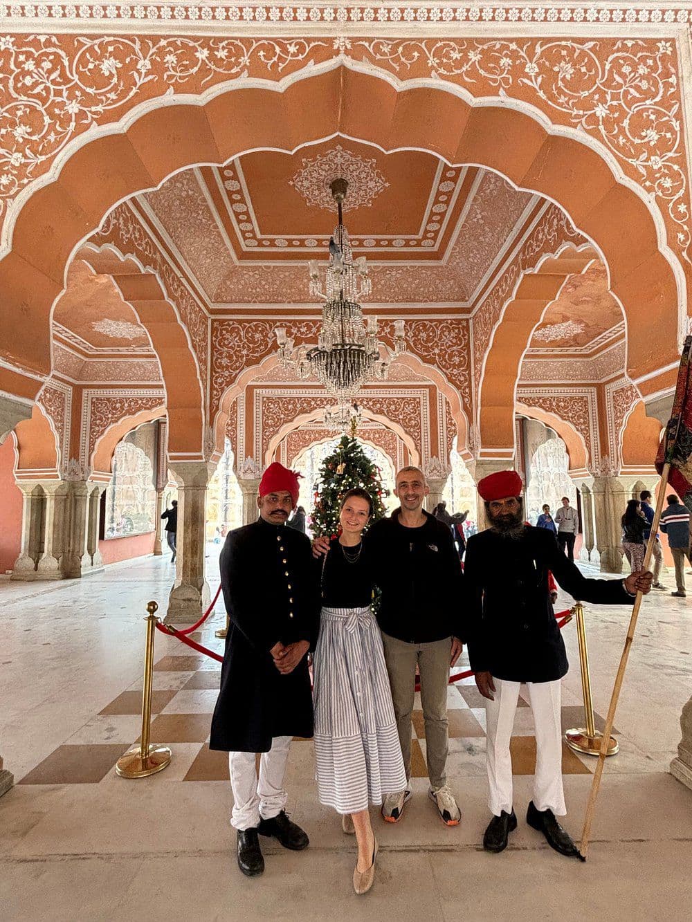 Traveler experiencing traditional Indian cultural attire with local women