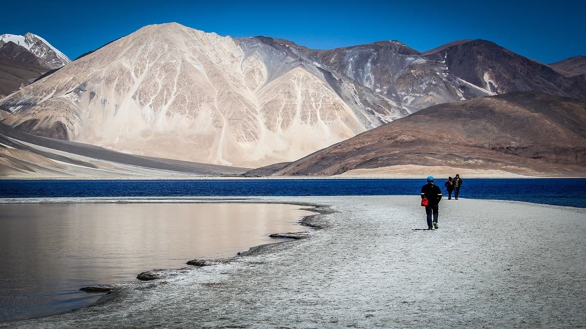 Pangong Lake Ladakh with crystal blue waters dramatic mountains and scenic views