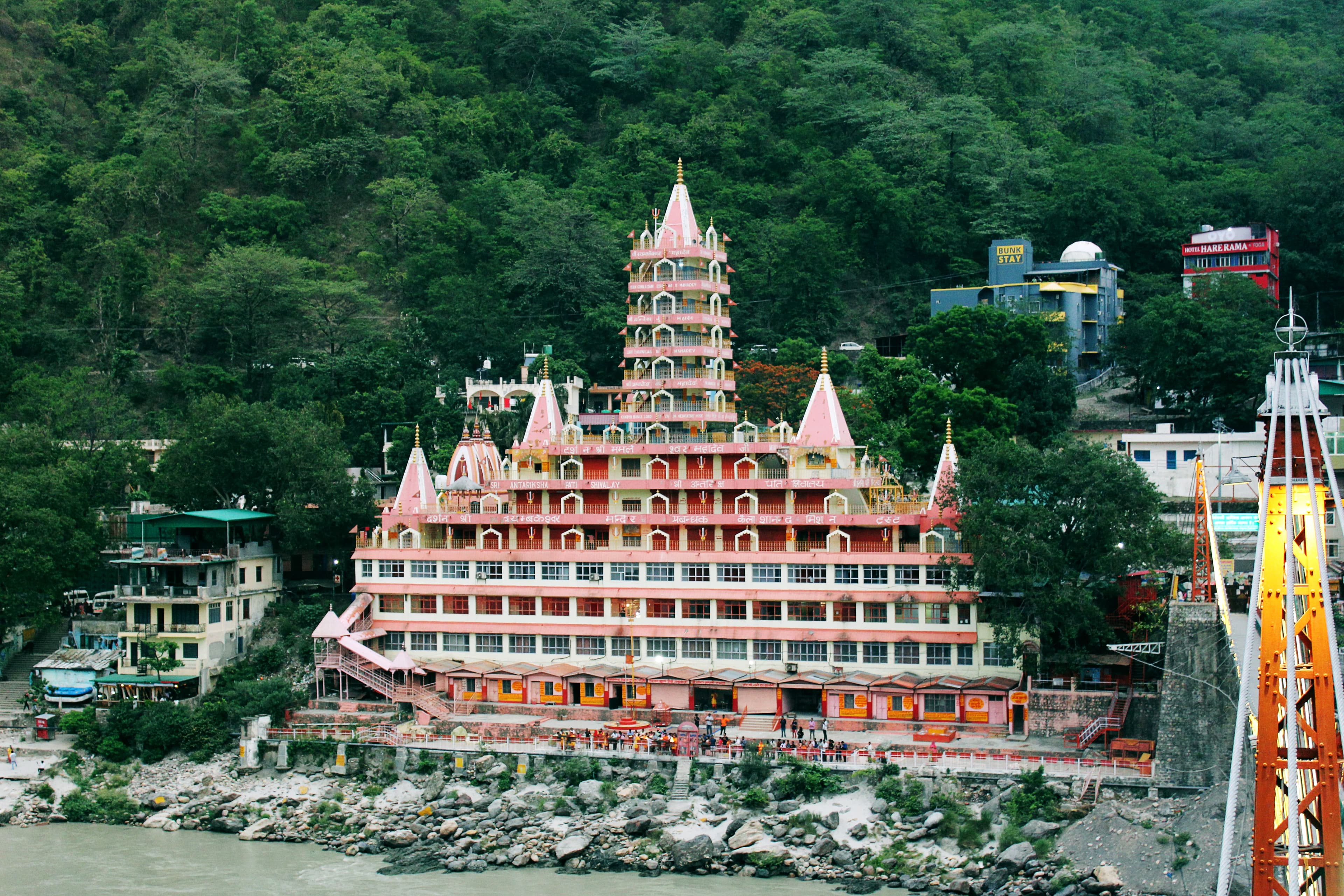 Sacred ghats, Ganga river, and forested Himalayan foothills of Rishikesh Uttarakhand India