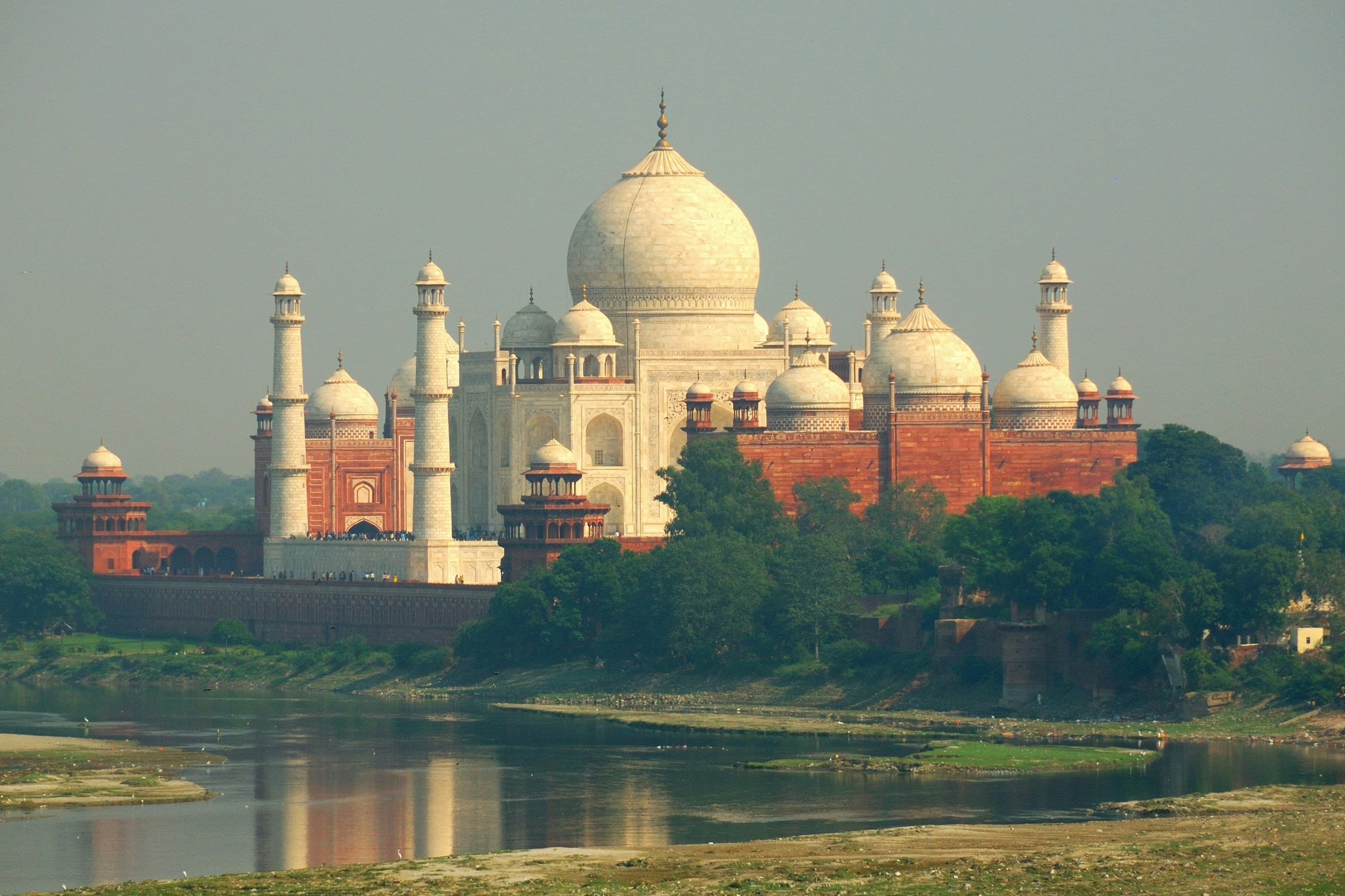 The Taj Mahal viewed across the Yamuna River from Mehtab Bagh at sunset