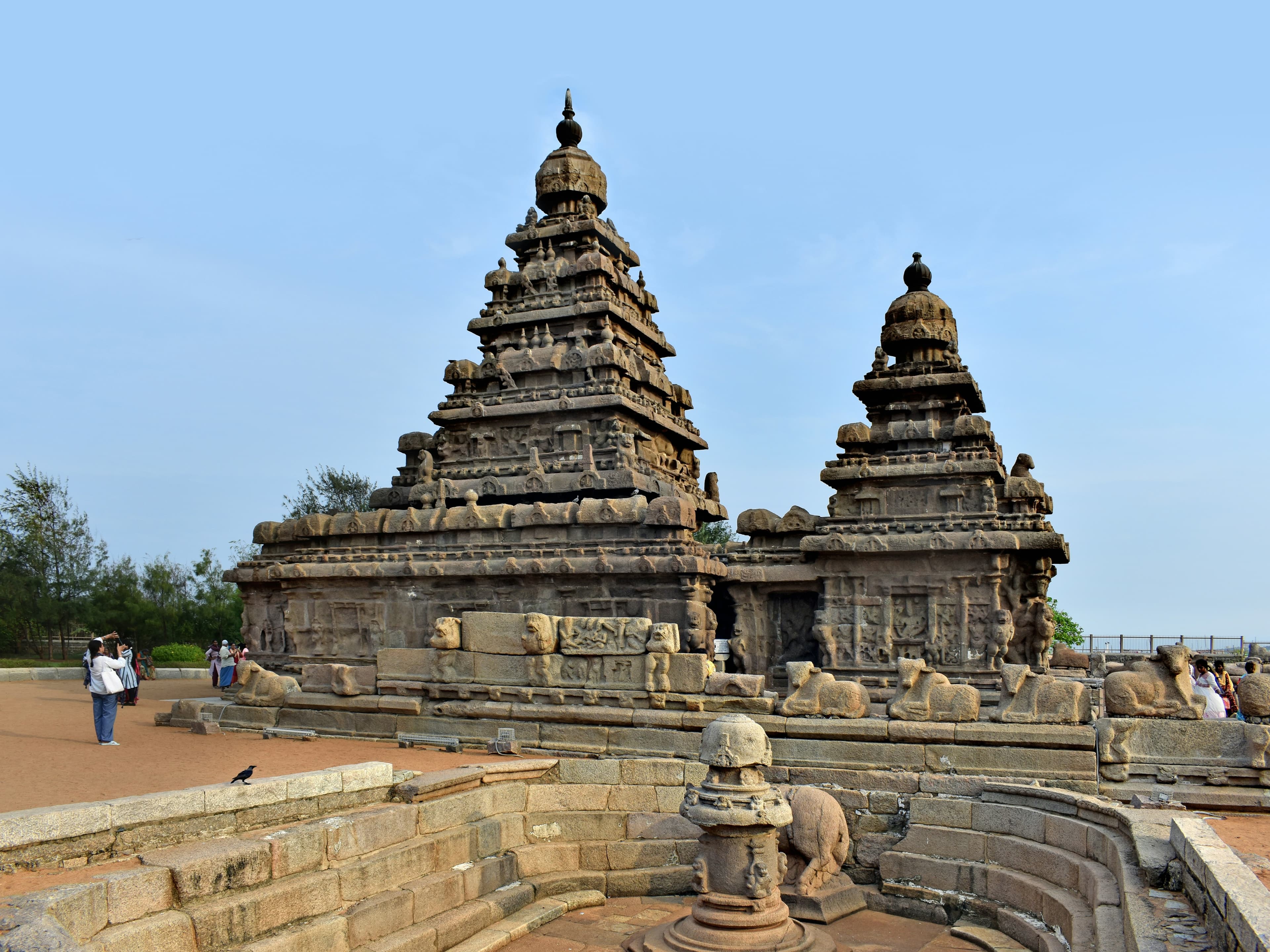 Shore Temple in Mahabalipuram silhouetted against a golden sunrise over the Bay of Bengal