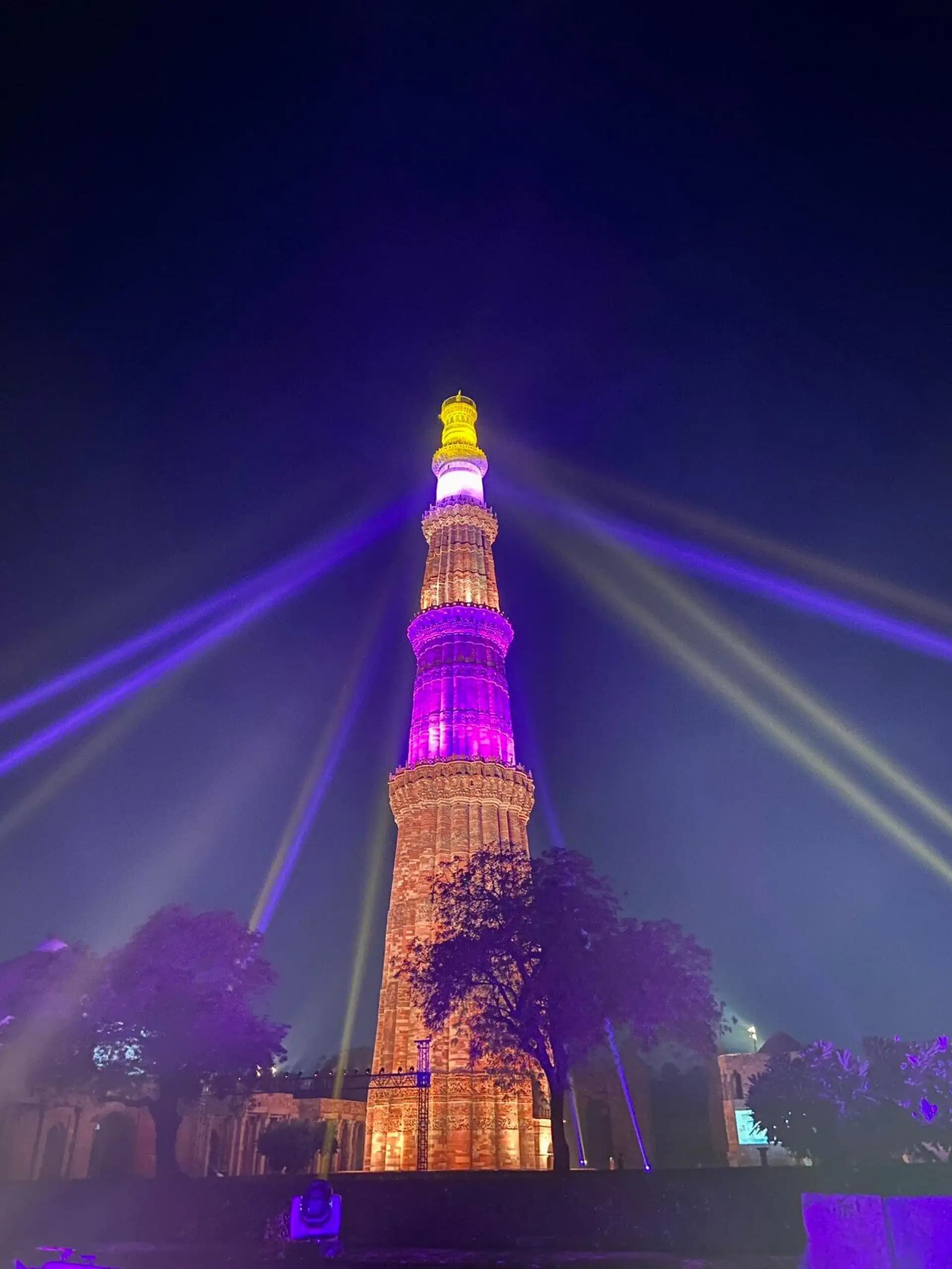 Qutub Minar Sound and Light Show - illuminated 73-metre tower with evening lights